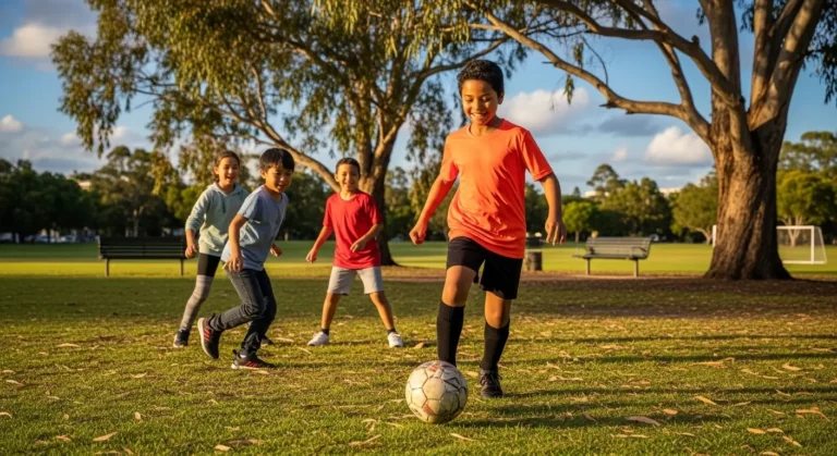Children playing soccer in park, North Lakes QLD